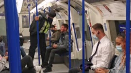 UK police officer enforces government's COVID-19 guidelines and remove man from tube for not wearing mask