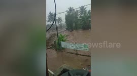 Dramatic moment two brothers are rescued from flash floods in Indonesia