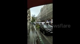Row of police vans line street near scene of Paris knife attack