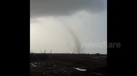 Tornado-like dust devil seen near Hong Kong airport