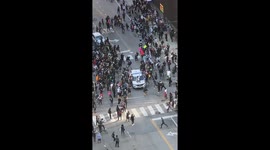 BLM protesters leap onto police cars during Chicago protest