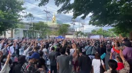 Thai Protesters Sing National Anthem Outside Parliament