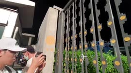Thai Protesters Stick Democracy Plaques On Parliament Gates