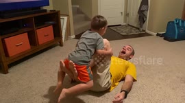 Father teaching his son to do a backflip