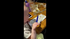 Cute 2 Year Old Toddler plays Bingo and calls out the numbers making everyone laugh