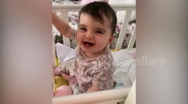 Magical moment baby with brittle bone disease stands up on her two feet for the first time