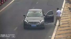 Iron bar smashes through car's front windscreen after being run over by truck on Chinese highway