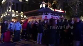 Drinkers in London's Leicester Square flout lockdown rules and gather on streets after 10pm curfew