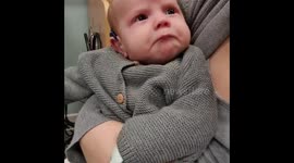 Baby overcome with emotion after hearing his parents for the first time with hearing aids