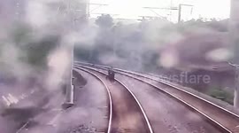 Train narrowly misses Chinese teenagers recording videos on railway tracks