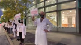 Doctors protest against President Trump during debate in Cleveland