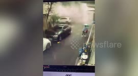 Scared mother and child flee after restaurant explodes behind them in central China