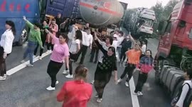 Chinese women dance on highway after getting stuck in traffic