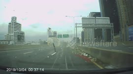 Delivery truck tips over on Thai highway after tyre blows out