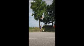 Overhead no look dropkick from behind the hoop