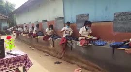 Students take class outside as teachers turn village into classroom in India