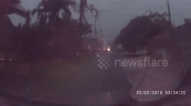 Power lines explode in front of car after being struck by lightning in Thailand