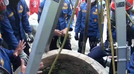 Indonesian firefighters rescue cat that fell down 50-foot-deep well in Jakarta