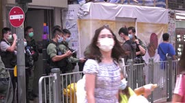 Heavy police presence subdues protests in Hong Kong on Chinese National Day