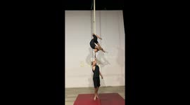 Duo Performing Dangerous Trapeze Trick
