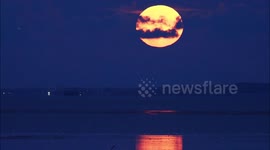 Full Harvest Moon rising above Herne Bay, UK