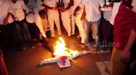 Modi's image burnt during protest over Hathras gang rape case