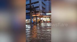 Bangkok drivers battle through floods as city deluged after tropical downpours