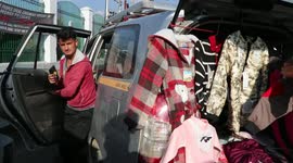 Tourist driver who turned his taxi cab into mobile cloth shop amid COVID-19 pandemic
