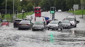 North London road flooded by heavy rains from Storm Alex