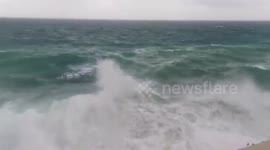 Large waves hit beach in France as Storm Alex arrives