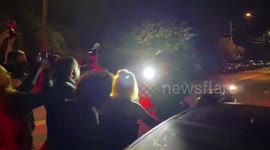 Protester dragged by distracted police officer on motorcycle during standoff in Portland, Oregon