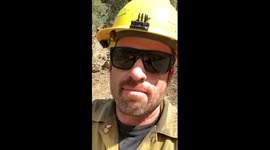 Fast moving brush fire with air attack water drops