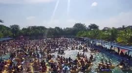 Police raid waterpark after thousands of locals have pool party in Covid-ravaged Indonesia