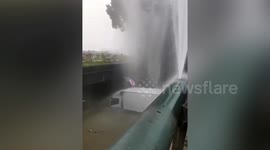 Truck driver rescued after swerving off-road and falling into river in east China