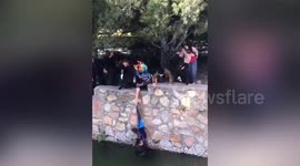Chinese tourists rescue teen boy after he falls into lake at China's Summer Palace