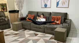 Flexible Brazilian woman performs impressive yoga poses at home during quarantine