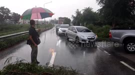 Tree falls on car after storms in Pattaya, eastern Thailand