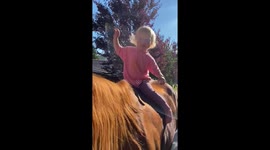 Little toddler riding bareback