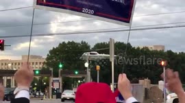 Trump supporters salute president as Marine One leaves Walter Reed Hospital