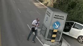 a car crashed into a toll house in the parking lot, incredible