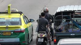 Thai motorcycle riders appear to ignore police announcement on fines for traffic offences