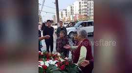 Pensioners stop wedding car to ask for money from motorist in central China