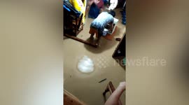 Residents battle to save possessions from flooded homes in the Philippines