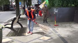 prevent the spread of covid 19, not wearing a mask punished sweeping the streets