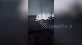Dark Grey Waterspout Forms Over Homes In The Philippines