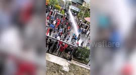 Indonesian police fire water cannons at protesters rallying against jobs law