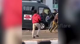 Indonesian protesters attack police vehicle during unrest over government's jobs law