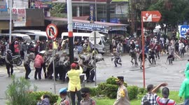 Indonesia students throw stones at police during protest against government's new labour law