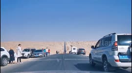 Chinese tourists take pictures on famous 'road of death' in China's Qinghai
