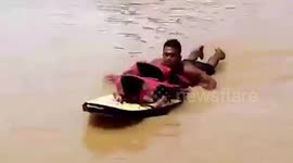 Stranded locals rescued as flash floods swamp homes in the Philippines